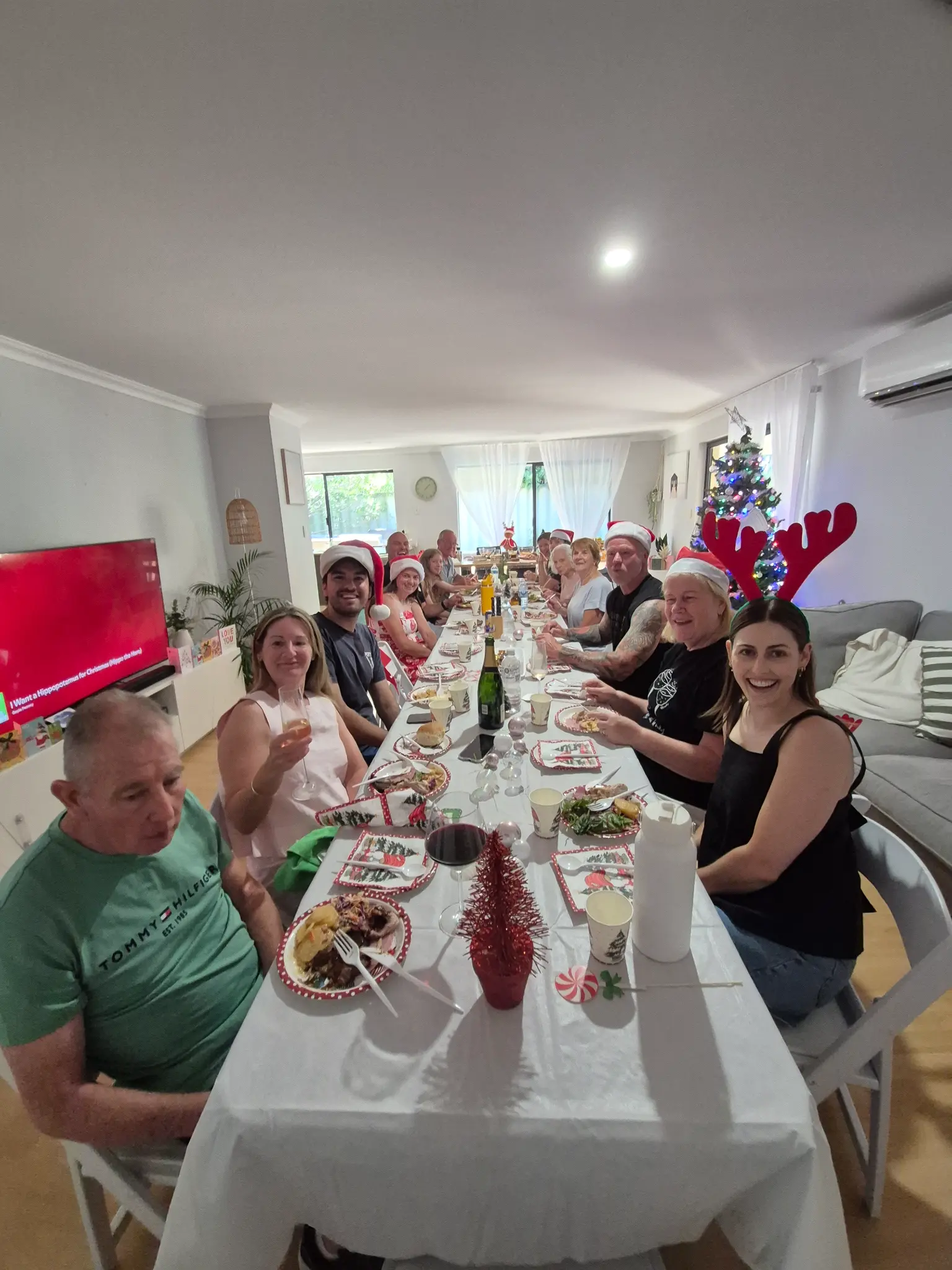 People sharing a Christmas meal together at the supported home