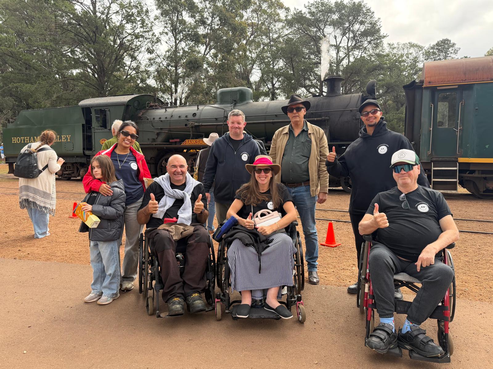 Happiness Crew members and participants together at a heritage train outing