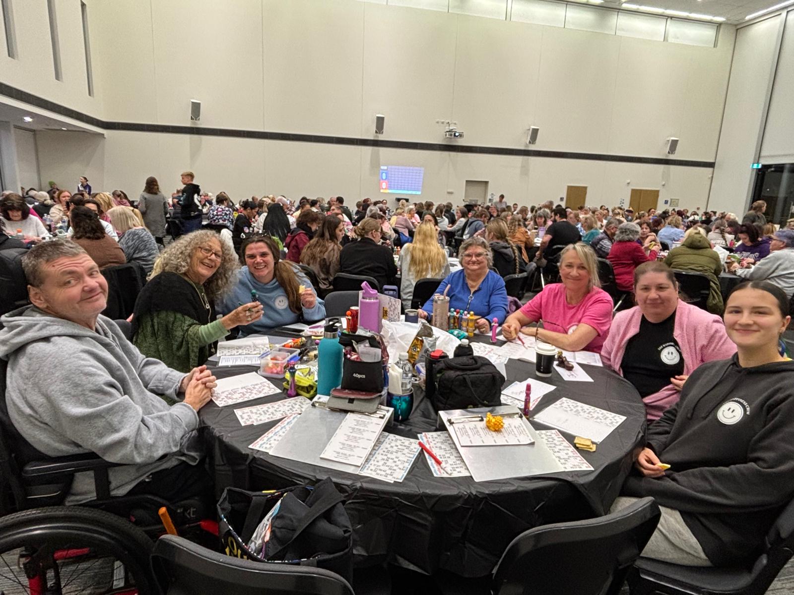Happiness Crew participants and team members enjoying a Venture Dayz community bingo event together