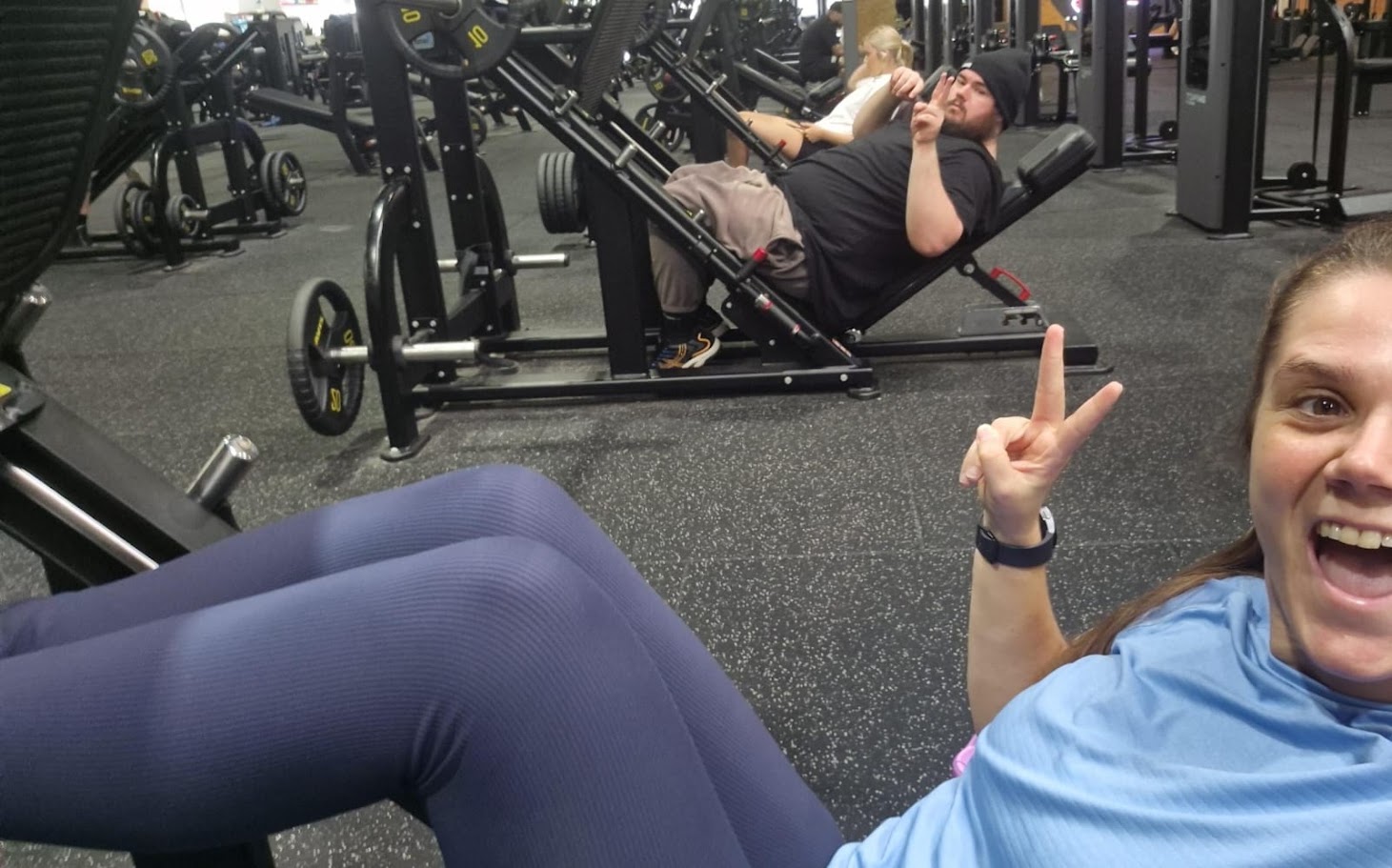 A Happiness Crew participant and support workers enjoying a gym session together