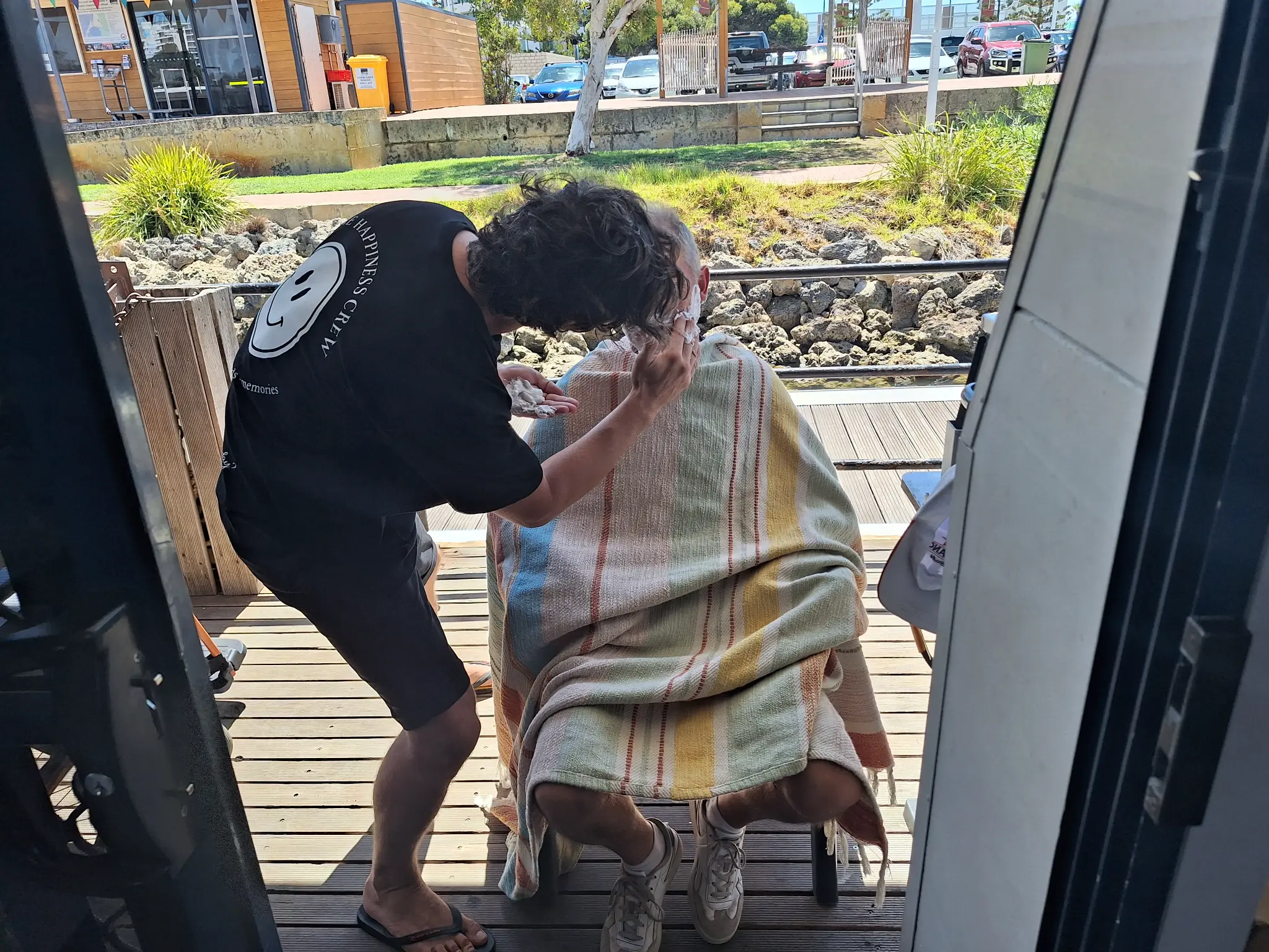 A Crew member providing respectful practical support to a participant at home