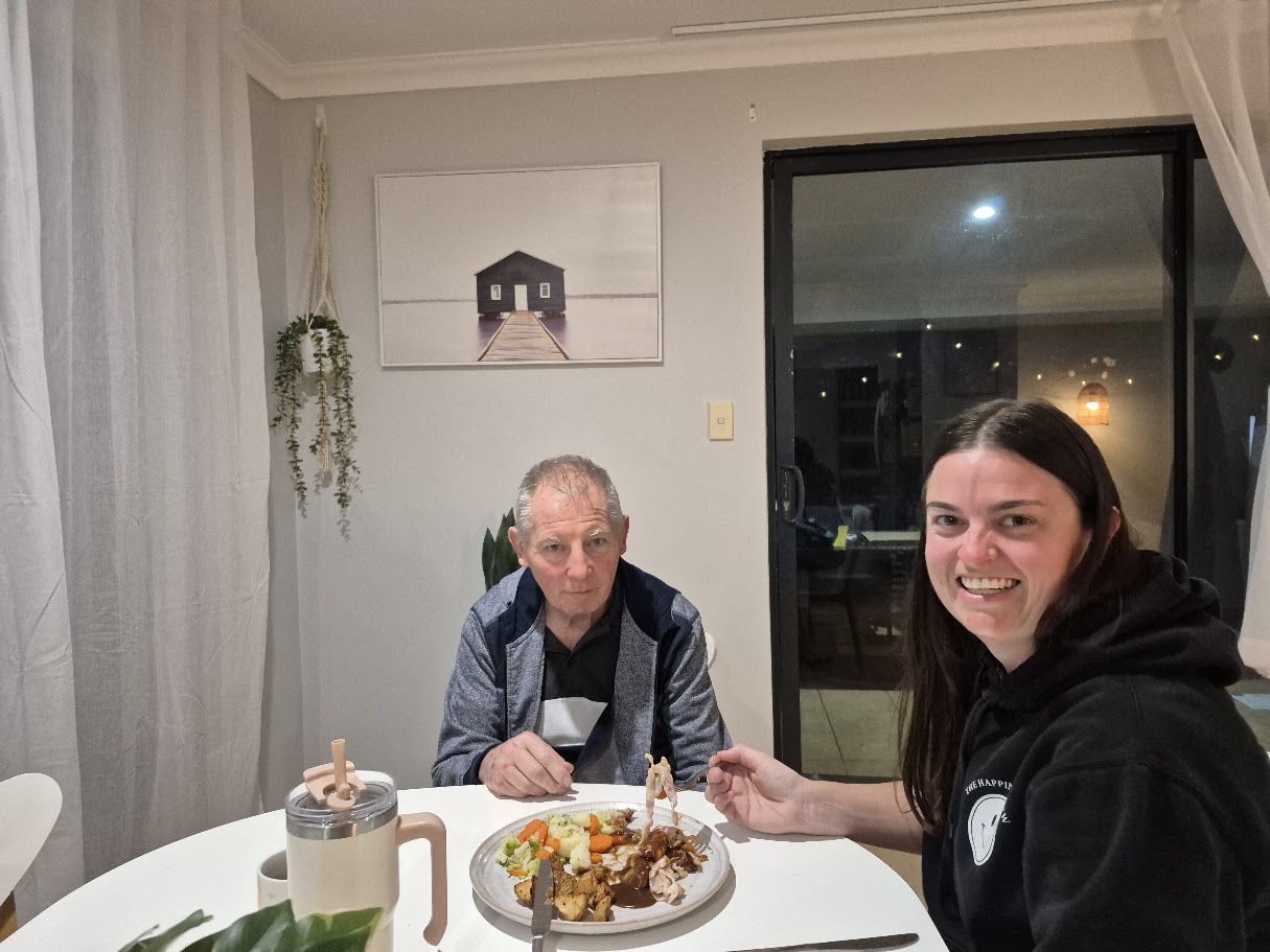 A participant sharing a meal with a Crew member at home