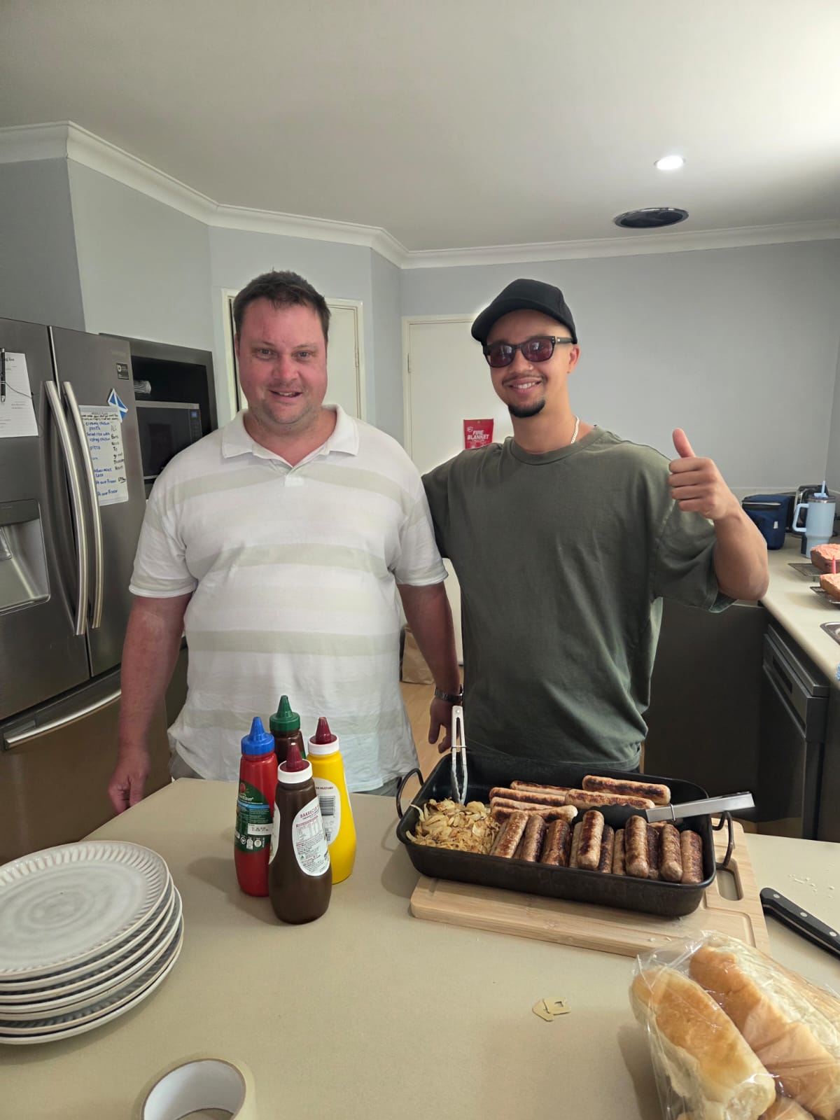 Two people preparing a barbecue together in a home kitchen
